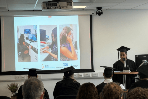 A picture of an intern at a lectern, giving a speech